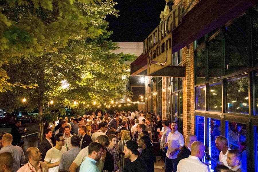 People hanging outside in the beer garden at Mile High Station